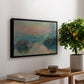 Sunset on the Seine at Lavacourt, Winter Effect, 1880 by Claude Monet, presented in a black floater framed canvas featuring a glowing sunset over snowy river landscape with soft reflections, displayed above a hallway console table.