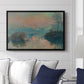 Sunset on the Seine at Lavacourt, Winter Effect, 1880 by Claude Monet displayed above a sofa in a living room in a black floater frame, featuring a winter scene with warm light reflecting on water at dusk.