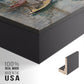 Close-up of the black floater frame corner and gallery wrapped canvas construction.