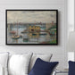 Bridge at Argenteuil on a Gray Day, c. 1876 by Claude Monet displayed above a sofa in a living room in a black floater frame, featuring an impressionist riverscape with overcast atmosphere and soft tones.
