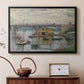 Black floater framed canvas featuring a calm water scene with bridge fading into cloudy sky, displayed above a cabinet in a soft-toned living room.