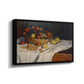Angled view of Still Life with Apples and Grapes, 1880 by Claude Monet in a black floater framed canvas.