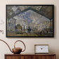 Black floater framed canvas featuring an industrial interior with steam clouds and rail tracks, displayed above a cabinet in a soft-toned living room.