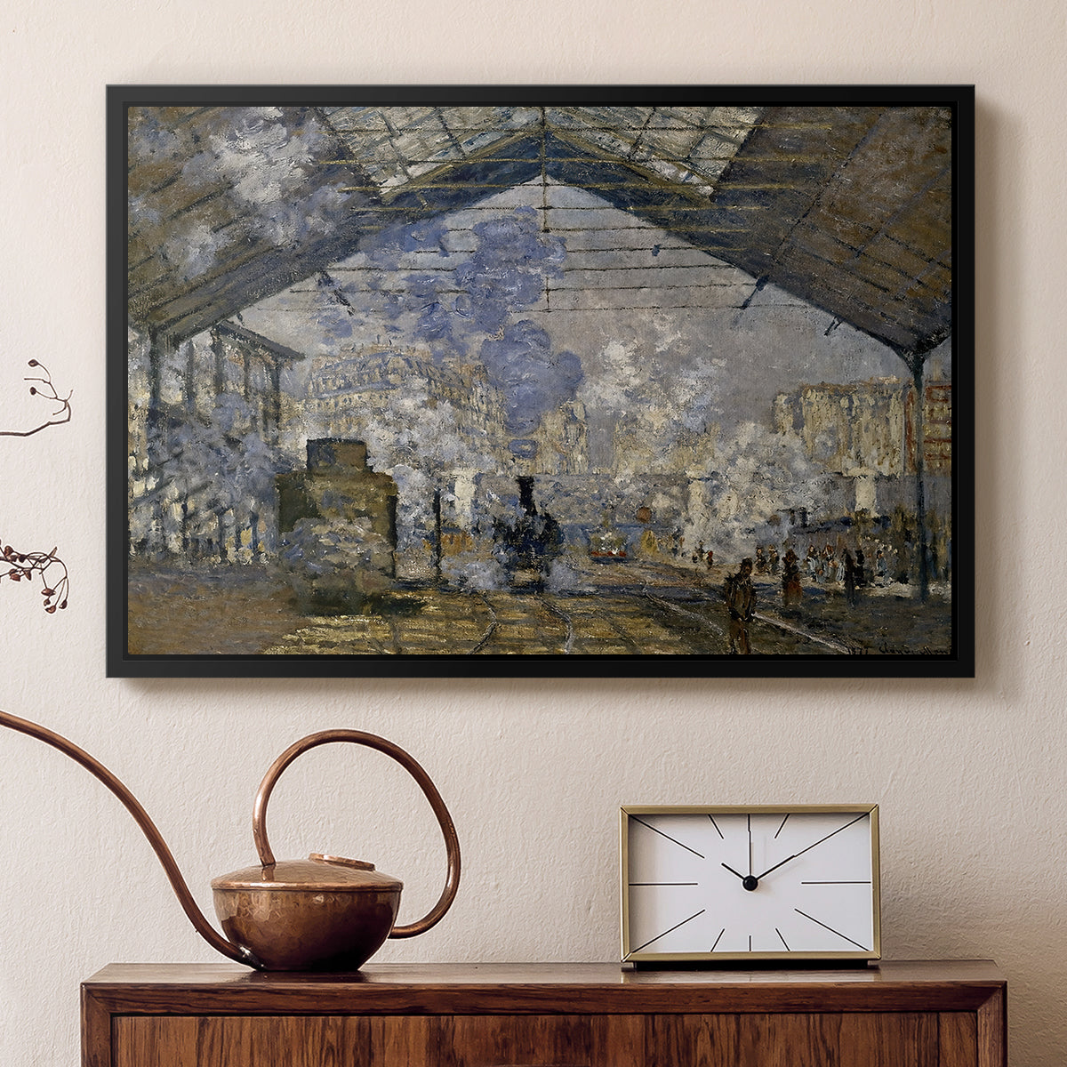 Black floater framed canvas featuring an industrial interior with steam clouds and rail tracks, displayed above a cabinet in a soft-toned living room.