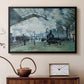 Black floater framed canvas featuring an interior view of station filled with movement and smoke, displayed above a cabinet in a soft-toned living room.