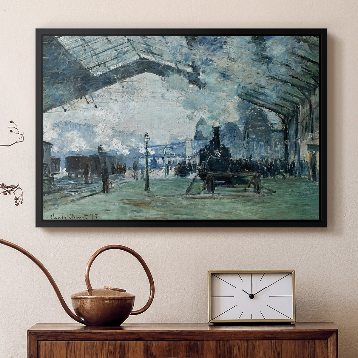Black floater framed canvas featuring an interior view of station filled with movement and smoke, displayed above a cabinet in a soft-toned living room.