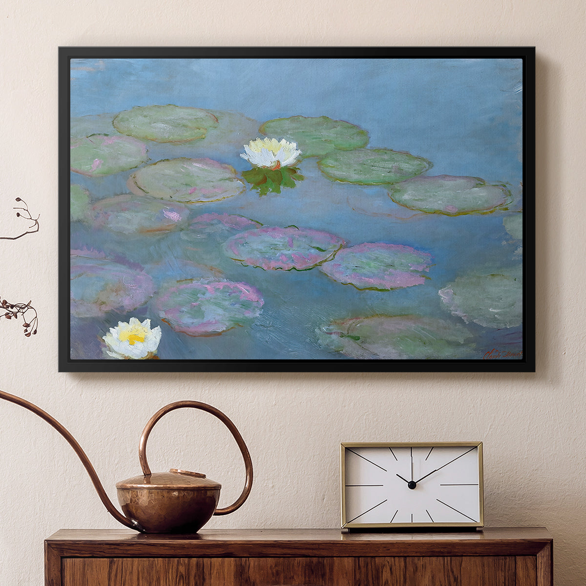 Black floater framed canvas featuring a tranquil water surface covered with blooming lilies, displayed above a cabinet in a soft-toned living room.