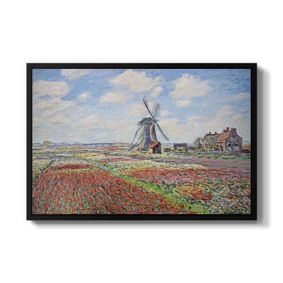 Tulip Fields with the Rijnsburg Windmill, 1886 by Claude Monet in a black floater framed canvas wall art display.
