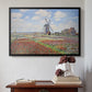 Black floater framed canvas featuring Tulip Fields with the Rijnsburg Windmill, 1886 by Claude Monet above an entryway table in a minimalist foyer.