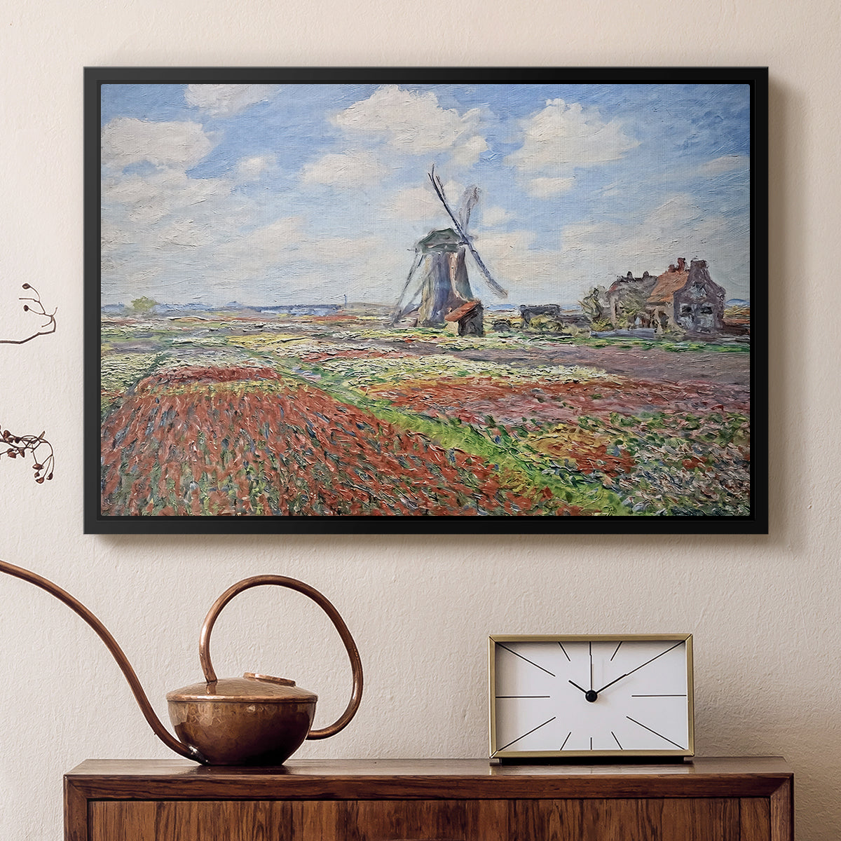 Black floater framed canvas featuring an impressionist field of blooming tulips under bright sky, displayed above a cabinet in a soft-toned living room.