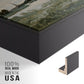 Close-up of the black floater frame corner and gallery wrapped canvas construction.