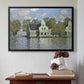 Black floater framed canvas featuring Houses on the Zaan River at Zaandam, 1871 by Claude Monet above an entryway table in a minimalist foyer.
