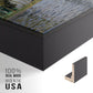 Close-up of the black floater frame corner and gallery wrapped canvas construction.