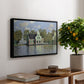 Houses on the Zaan River at Zaandam, 1871 by Claude Monet, presented in a black floater framed canvas featuring a row of houses along river with reflections in calm water, displayed above a hallway console table.