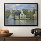 Houses on the Zaan River at Zaandam, 1871 by Claude Monet in a black floater framed canvas displayed above a console table in a hallway, featuring a waterfront architecture with still reflections.