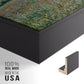 Close-up of the black floater frame corner and gallery wrapped canvas construction.