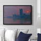 The Houses of Parliament, Sunset, 1903 by Claude Monet displayed above a sofa in a living room in a black floater frame, featuring an impressionist cityscape with warm sunset light over water.