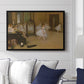 The Dancing Class, c. 1870 by Edgar Degas displayed above a sofa in a living room in a black floater frame, featuring a rehearsal scene with ballerinas in tutus arranged in studio.