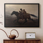 Black floater framed canvas featuring a narrative painting of escape and urgency across rugged terrain, displayed above a cabinet in a soft-toned living room.