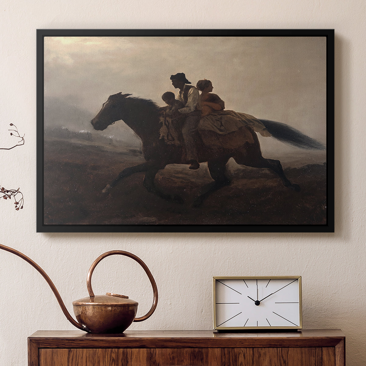 Black floater framed canvas featuring a narrative painting of escape and urgency across rugged terrain, displayed above a cabinet in a soft-toned living room.