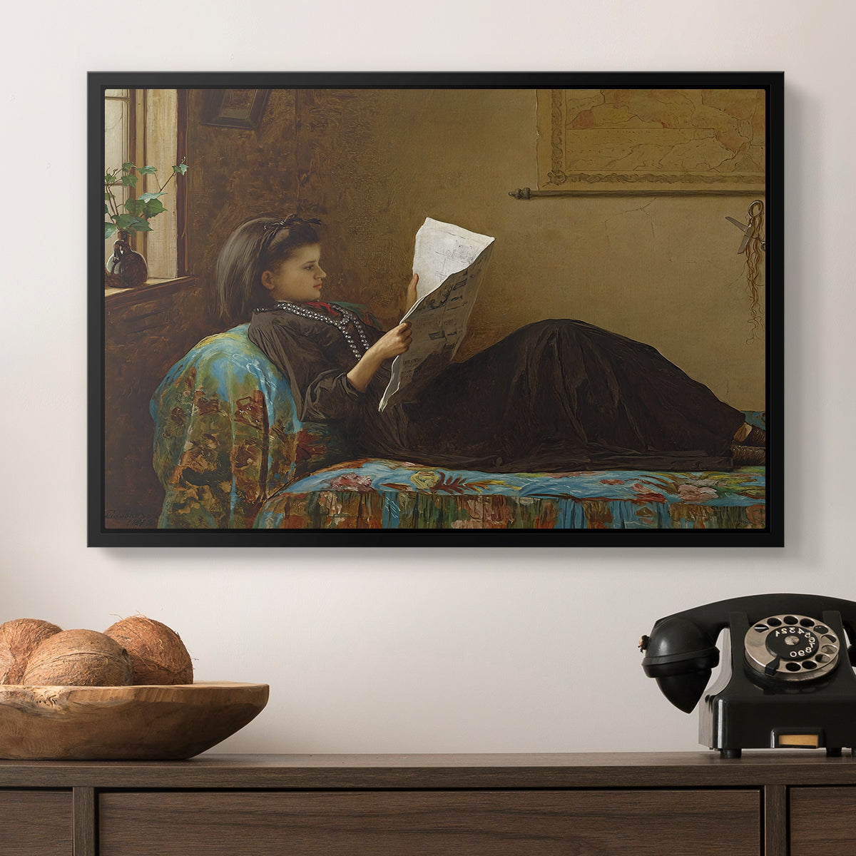 Interesting News, 1872 by Eastman Johnson in a black floater framed canvas displayed above a console table in a hallway, featuring a casual gathering around newspaper in rustic room.