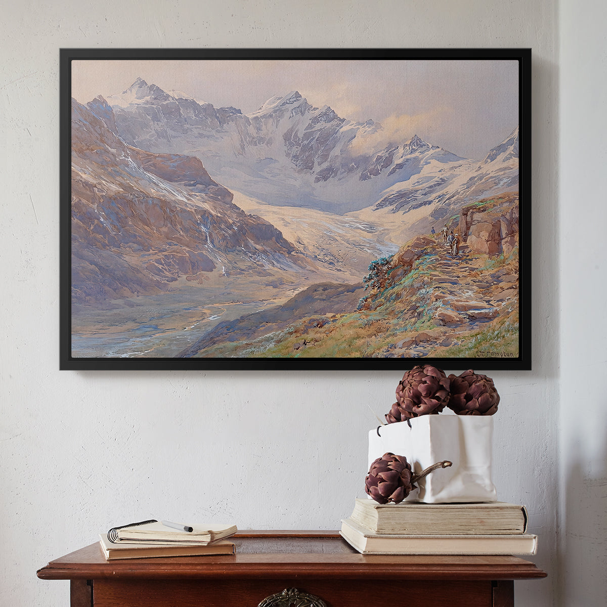 Black floater framed canvas featuring Odenwinklkees with the Johannisberg, 1902 by Edward Theodore Compton above an entryway table in a minimalist foyer.