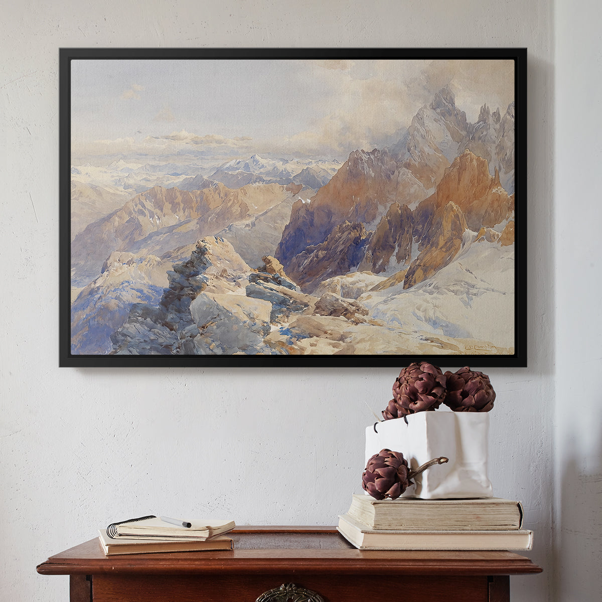 Black floater framed canvas featuring Col du Géant, 1903 by Edward Theodore Compton above an entryway table in a minimalist foyer.