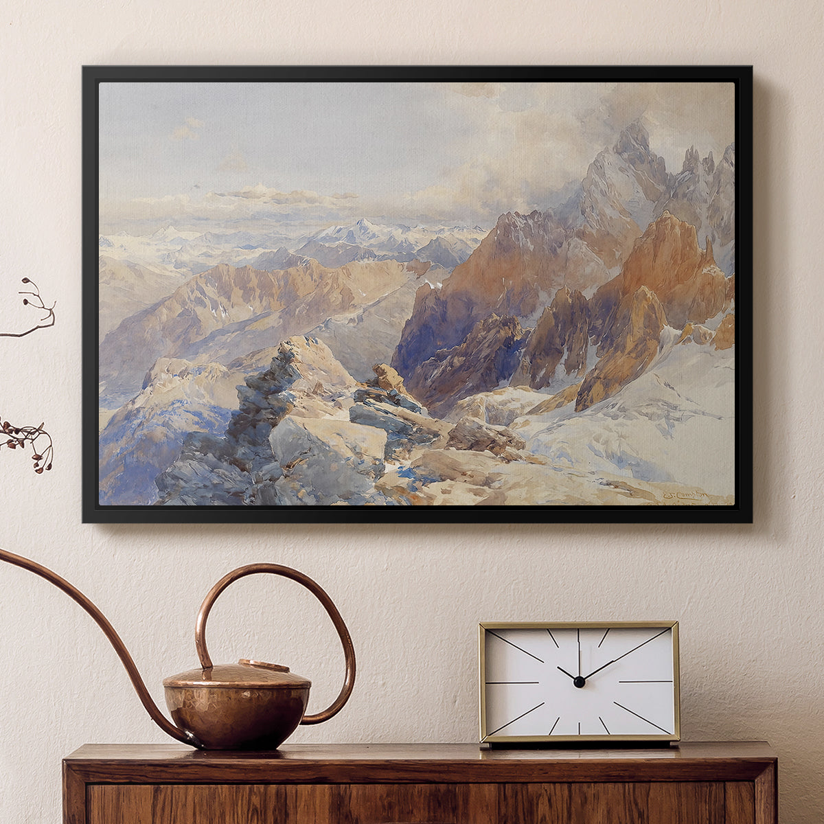 Black floater framed canvas featuring a panoramic alpine view with snow and rocky cliffs, displayed above a cabinet in a soft-toned living room.