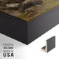 Close-up of the black floater frame corner and gallery wrapped canvas construction.