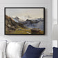 The Großglockner from the Prager Hut, 1890 by Edward Theodore Compton displayed above a sofa in a living room in a black floater frame, featuring a mountain summit seen from elevated viewpoint with surrounding landscape.