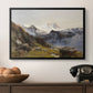 The Großglockner from the Prager Hut, 1890 by Edward Theodore Compton in a black floater framed canvas displayed above a console table in a hallway, featuring a scenic mountain view with dramatic elevation and depth.