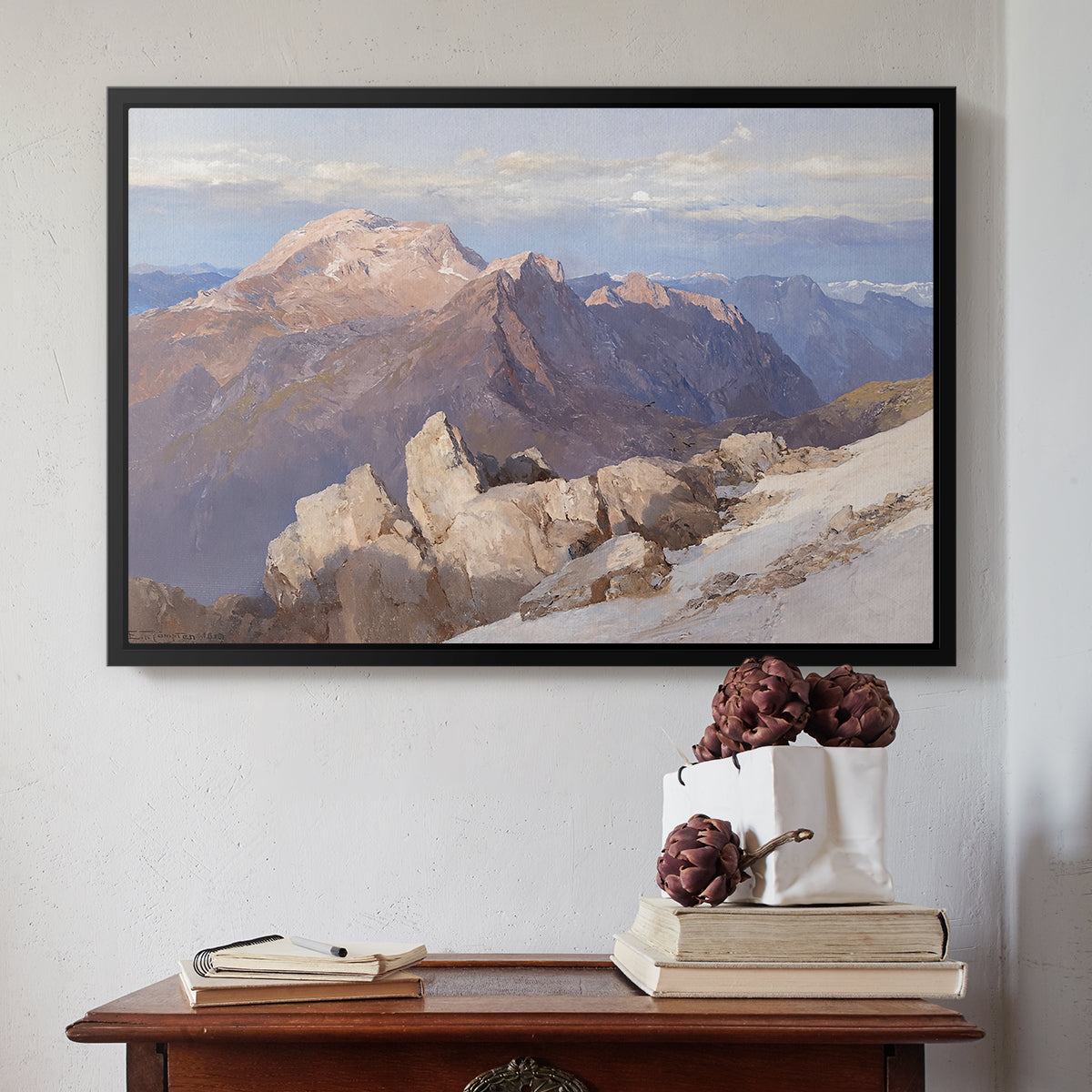 Black floater framed canvas featuring Hoher Göll from Watzmann-Hocheck, 1919 by Edward Theodore Compton above an entryway table in a minimalist foyer.