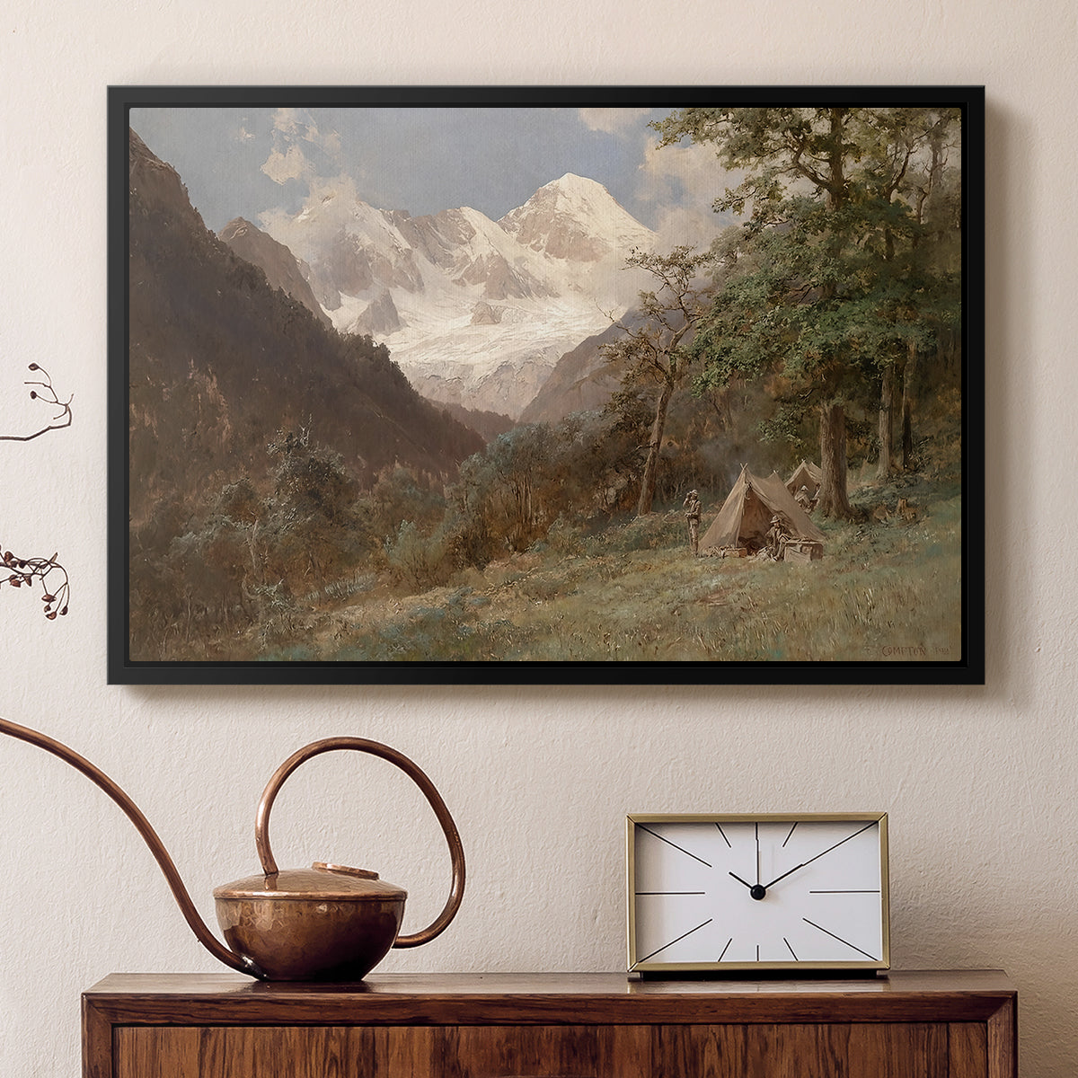 Black floater framed canvas featuring a natural scene with valleys and rocky formations, displayed above a cabinet in a soft-toned living room.