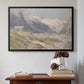 Black floater framed canvas featuring Shepherds (Pasterze), c. 1921 by Edward Theodore Compton above an entryway table in a minimalist foyer.