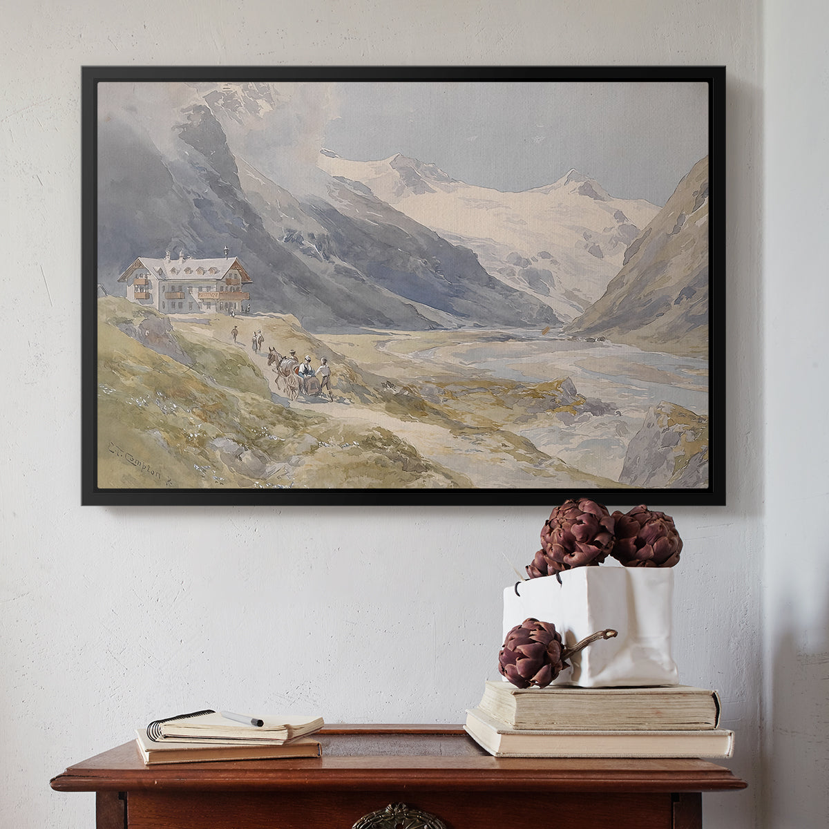 Black floater framed canvas featuring Shepherds (Pasterze), c. 1921 by Edward Theodore Compton above an entryway table in a minimalist foyer.