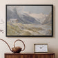 Black floater framed canvas featuring a rural alpine setting with shepherds and open terrain, displayed above a cabinet in a soft-toned living room.