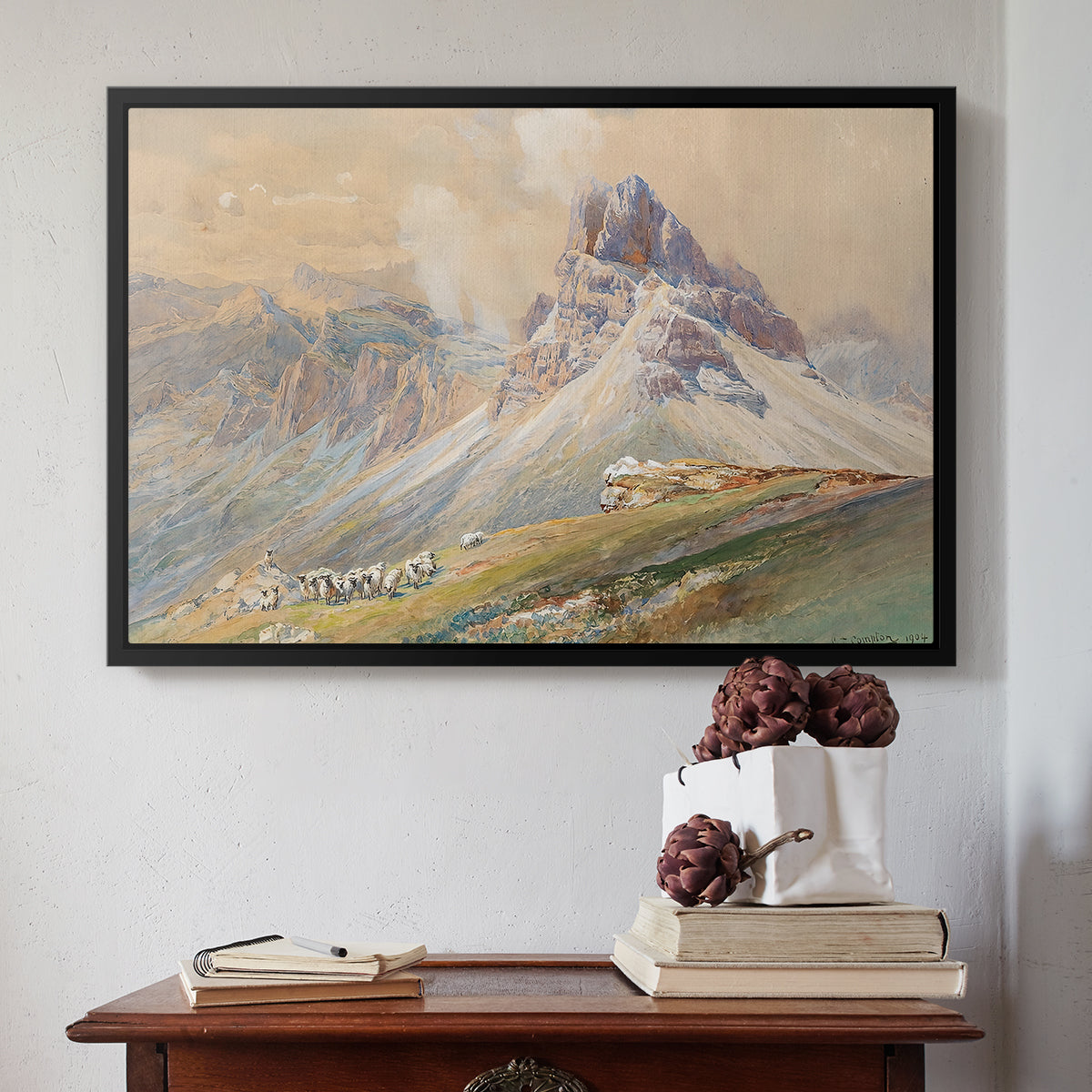 Black floater framed canvas featuring From the Dolomites, 1904 by Edward Theodore Compton above an entryway table in a minimalist foyer.