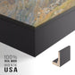 Close-up of the black floater frame corner and gallery wrapped canvas construction.