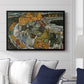 Crescent of Houses II (Island Town), 1915 by Egon Schiele displayed above a sofa in a living room in a black floater frame, featuring a stylized townscape with clustered buildings and bold outlines.