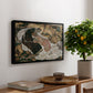 Death and the Maiden, 1915 by Egon Schiele, presented in a black floater framed canvas featuring intertwined figures representing death and woman in emotional embrace, displayed above a hallway console table.