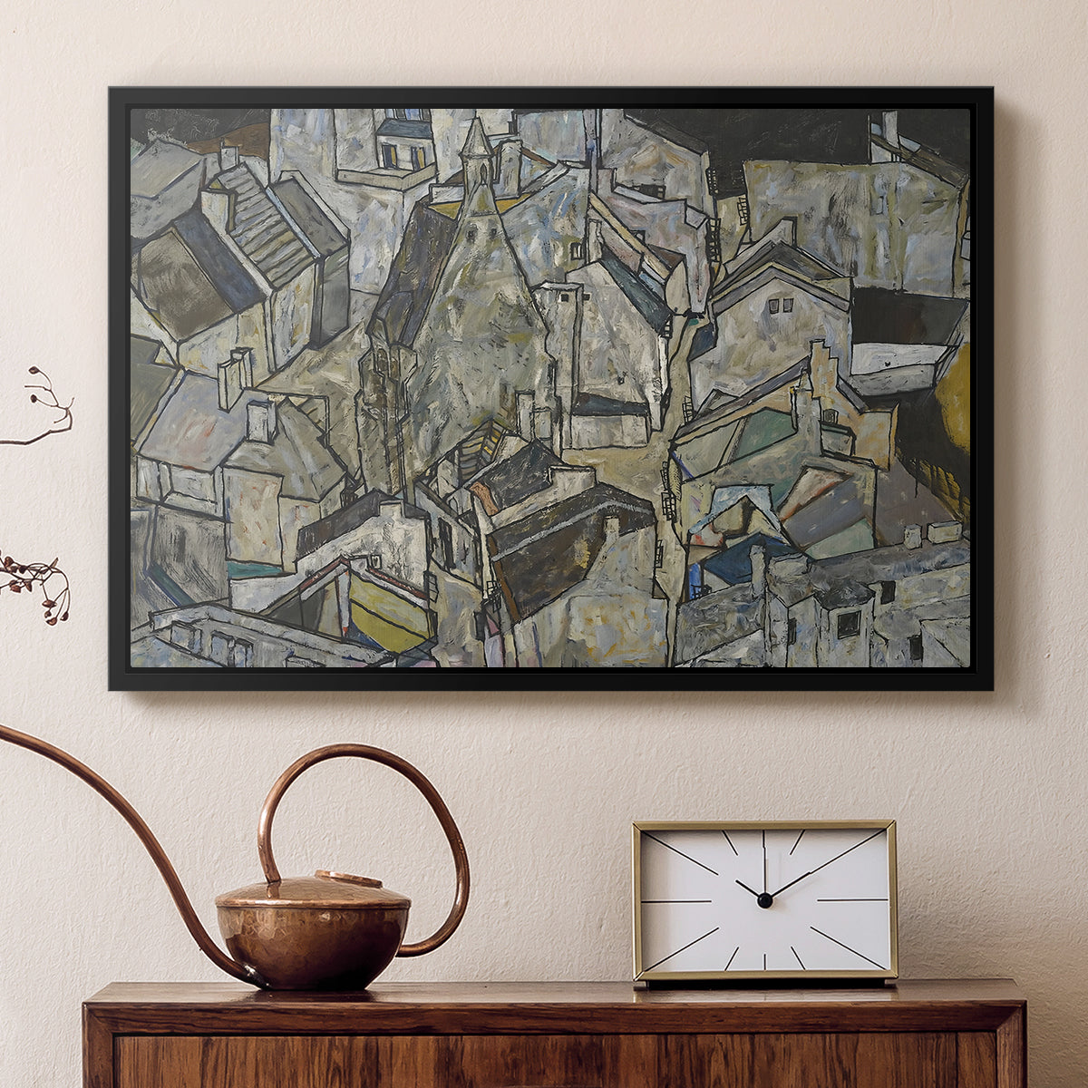 Black floater framed canvas featuring an abstracted town view with angular rooftops and fragmented forms, displayed above a cabinet in a soft-toned living room.