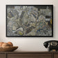 Mödling II, 1918 by Egon Schiele in a black floater framed canvas displayed above a console table in a hallway, featuring a stylized urban composition with geometric structures and muted tones.