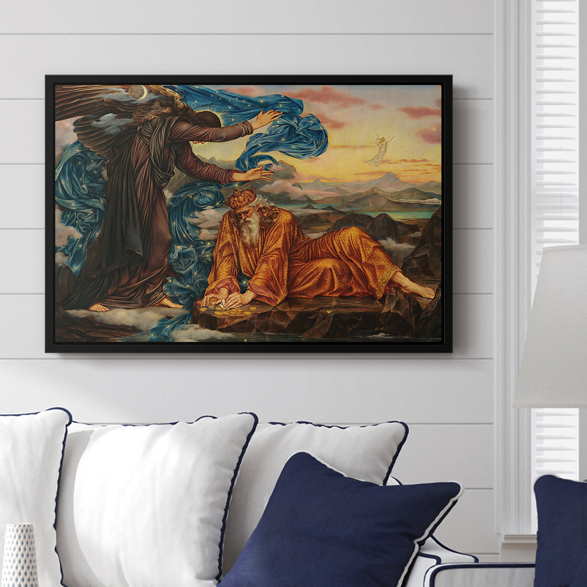 Earthbound, 1897 by Evelyn De Morgan displayed above a sofa in a living room in a black floater frame, featuring an allegorical scene with woman resting amid flowing drapery and landscape.