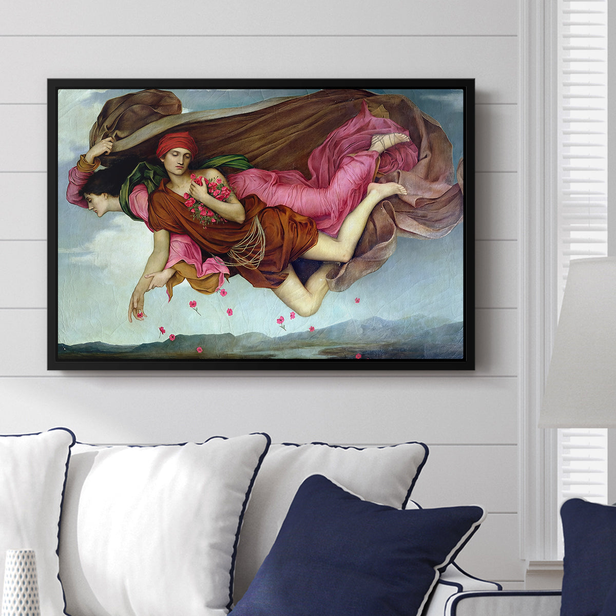 Night and Sleep, 1878 by Evelyn De Morgan displayed above a sofa in a living room in a black floater frame, featuring a symbolic depiction of night and sleep as ethereal figures in motion.