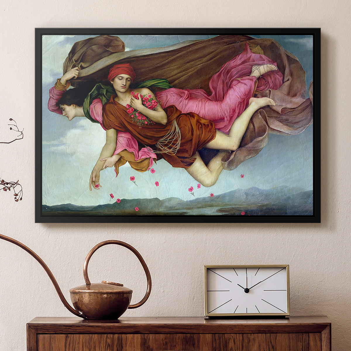 Black floater framed canvas featuring a dreamlike scene with draped figures drifting across dark background, displayed above a cabinet in a soft-toned living room.
