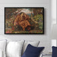 A Soul in Hell, c. 1901-1902 by Evelyn De Morgan displayed above a sofa in a living room in a black floater frame, featuring a dramatic allegory of suffering with figure engulfed in fiery environment.