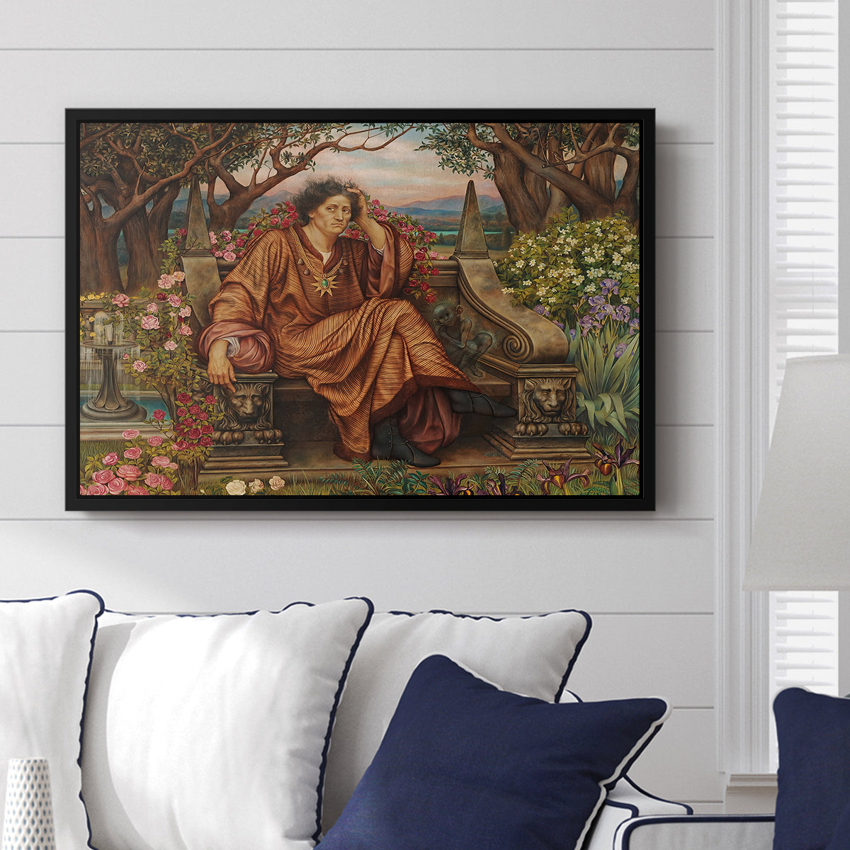 A Soul in Hell, c. 1901-1902 by Evelyn De Morgan displayed above a sofa in a living room in a black floater frame, featuring a dramatic allegory of suffering with figure engulfed in fiery environment.