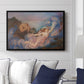 Twilight, 1914 by Evelyn De Morgan displayed above a sofa in a living room in a black floater frame, featuring an allegorical figure resting in atmospheric dusk setting.