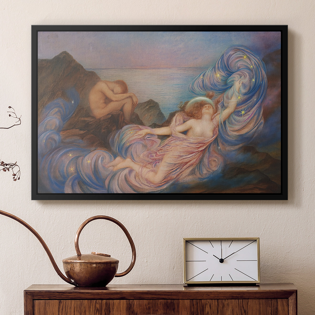 Black floater framed canvas featuring a dreamlike composition with woman in fading light, displayed above a cabinet in a soft-toned living room.