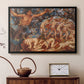Black floater framed canvas featuring an energetic depiction of figures swept through air by wind, displayed above a cabinet in a soft-toned living room.